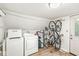 Functional laundry room with washer, dryer, and storage for household needs at 809 Iron Bridge Rd, Cicero, IN 46034