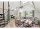 Open concept living room with vaulted ceilings, spiral staircase, and a modern kitchen at 809 Iron Bridge Rd, Cicero, IN 46034