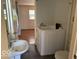 Accessible bathroom with a walk-in tub, a vanity sink, and neutral fixtures at 909 Hickory St, Anderson, IN 46012