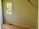 Bright bedroom with a laminate floor, natural light, and a minimalist design at 909 Hickory St, Anderson, IN 46012