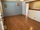 Spacious living room boasting wood-look flooring, natural light, and open access to other rooms at 909 Hickory St, Anderson, IN 46012