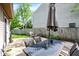Outdoor patio features dining table, seating area and built-in fire pit at 9255 Fireside Dr, Indianapolis, IN 46250