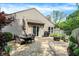 Outdoor patio features dining table, seating area and built-in fire pit at 9255 Fireside Dr, Indianapolis, IN 46250