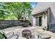 Outdoor patio features dining table, seating area and built-in fire pit at 9255 Fireside Dr, Indianapolis, IN 46250