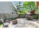 Outdoor patio features dining table, seating area and built-in fire pit at 9255 Fireside Dr, Indianapolis, IN 46250