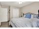 Charming bedroom featuring a soft bed, a closet, and a window with plenty of natural light at 9255 Fireside Dr, Indianapolis, IN 46250