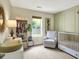 Charming Bedroom with crib, rocking chair, and natural light from a large window at 9255 Fireside Dr, Indianapolis, IN 46250