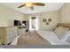 Cozy bedroom with soft lighting, a comfortable bed, and a dresser with a television for entertainment at 9255 Fireside Dr, Indianapolis, IN 46250