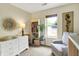 Comfortable Bedroom with a crib, rocking chair, dresser and bright window at 9255 Fireside Dr, Indianapolis, IN 46250
