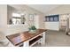 Bright dining area features a rustic wooden table and bench with view to the kitchen at 9255 Fireside Dr, Indianapolis, IN 46250