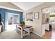 Bright dining area with patio access and a glimpse into the modern kitchen at 9255 Fireside Dr, Indianapolis, IN 46250