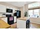 Bright kitchen with a center island, black appliances, and wooden countertops at 9255 Fireside Dr, Indianapolis, IN 46250