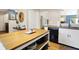 Kitchen with island and butcher block countertop; complements nearby living space at 9255 Fireside Dr, Indianapolis, IN 46250