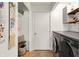 Functional laundry room equipped with washer, dryer, and shelving creating a clean and efficient space at 9255 Fireside Dr, Indianapolis, IN 46250