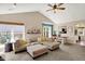 Bright living room with comfortable seating, vaulted ceilings and access to the kitchen at 9255 Fireside Dr, Indianapolis, IN 46250
