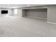 Spacious carpeted basement with a window for natural light and a blank canvas for customization at 10155 Landis Blvd, Fortville, IN 46040