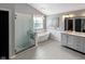 Bright bathroom featuring a freestanding tub, walk-in shower, and modern vanity with great lighting at 10155 Landis Blvd, Fortville, IN 46040