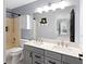Bathroom with a double vanity, shower, and updated fixtures at 10155 Landis Blvd, Fortville, IN 46040
