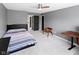A modern bedroom featuring a stylish bed frame, gray walls, and complementary decor for a cozy retreat at 10155 Landis Blvd, Fortville, IN 46040