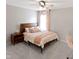 Comfortable bedroom with a plush bed, side table, and window, bathed in soft, natural light at 10155 Landis Blvd, Fortville, IN 46040