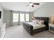 Main bedroom features vaulted ceiling, three windows, and plush carpeting at 10155 Landis Blvd, Fortville, IN 46040