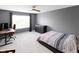Neutral bedroom setup with a bed, dresser, and desk area at 10155 Landis Blvd, Fortville, IN 46040