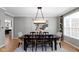 Elegant dining room with seating for six and modern chandelier at 10155 Landis Blvd, Fortville, IN 46040