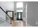 The home's foyer features hardwood floors and a high ceiling at 10155 Landis Blvd, Fortville, IN 46040
