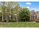 Charming two-story brick home with mature trees and manicured lawn at 10155 Landis Blvd, Fortville, IN 46040