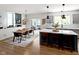 View of kitchen and dining areas showing modern furnishings, and stainless appliances at 10155 Landis Blvd, Fortville, IN 46040