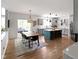 Open kitchen and dining area with modern appliances and a center island with breakfast bar at 10155 Landis Blvd, Fortville, IN 46040