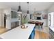 Open concept kitchen with an island, pendant lighting, and stainless steel appliances at 10155 Landis Blvd, Fortville, IN 46040