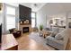 Spacious living room with tall ceilings, large windows, stylish fireplace, and modern decor at 10155 Landis Blvd, Fortville, IN 46040