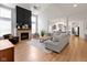 Spacious living room featuring a fireplace and open access to the kitchen and dining area at 10155 Landis Blvd, Fortville, IN 46040
