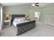 Spacious main bedroom with a plush upholstered bed and a view into the ensuite bathroom at 10155 Landis Blvd, Fortville, IN 46040