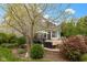 Inviting backyard patio with comfortable seating surrounded by beautiful landscaping at 10155 Landis Blvd, Fortville, IN 46040