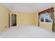 Large bedroom with closet and doorway to bathroom at 10833 Tournament Ln, Indianapolis, IN 46229