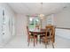 Dining room featuring a wooden table, built-in cabinets, and a door to the backyard at 10833 Tournament Ln, Indianapolis, IN 46229