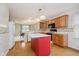 Traditional kitchen with island, wooden cabinets, and bright countertops at 10833 Tournament Ln, Indianapolis, IN 46229