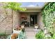 Inviting front porch with a cozy bench, potted flowers, and decorative greenery at 10833 Tournament Ln, Indianapolis, IN 46229