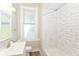 Updated bathroom with new fixtures, tiled shower, and modern vanity at 1115 N Keystone Ave, Indianapolis, IN 46201