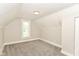 Bedroom with neutral paint, gray carpet, and a bright window at 1115 N Keystone Ave, Indianapolis, IN 46201