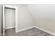 Bedroom with neutral paint, gray carpet, and white trim around the doorframe at 1115 N Keystone Ave, Indianapolis, IN 46201