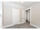 Bedroom with neutral paint, gray carpet, and white doors at 1115 N Keystone Ave, Indianapolis, IN 46201