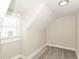 Bright bedroom with neutral paint, plush gray carpet, and a window at 1115 N Keystone Ave, Indianapolis, IN 46201