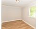 Standard bedroom with hardwood floors, natural light, and neutral paint at 1115 N Keystone Ave, Indianapolis, IN 46201