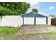 Two-car detached garage featuring white garage doors with a concrete driveway at 1115 N Keystone Ave, Indianapolis, IN 46201