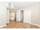 Open living area with access to the kitchen, stairs, and multiple doorways at 1115 N Keystone Ave, Indianapolis, IN 46201
