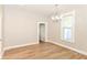 Bright living room with lots of natural light, hardwood floors and neutral paint at 1115 N Keystone Ave, Indianapolis, IN 46201