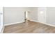 Spacious living room with new flooring and natural light, adjacent to entry door at 1115 N Keystone Ave, Indianapolis, IN 46201